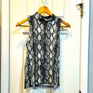 Eye Candy sleeveless shirt.  Size L.  Runs small. Super cute